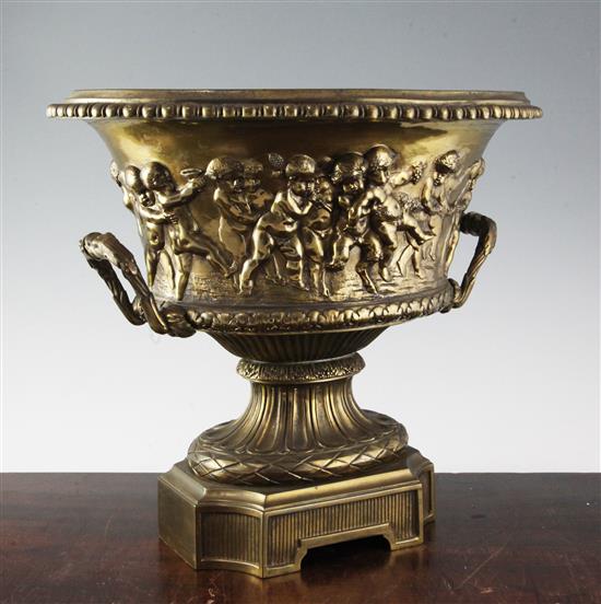 A large gilt bronze two handled oval vase, moulded with continuous bacchanalian scene, height 14.75in.